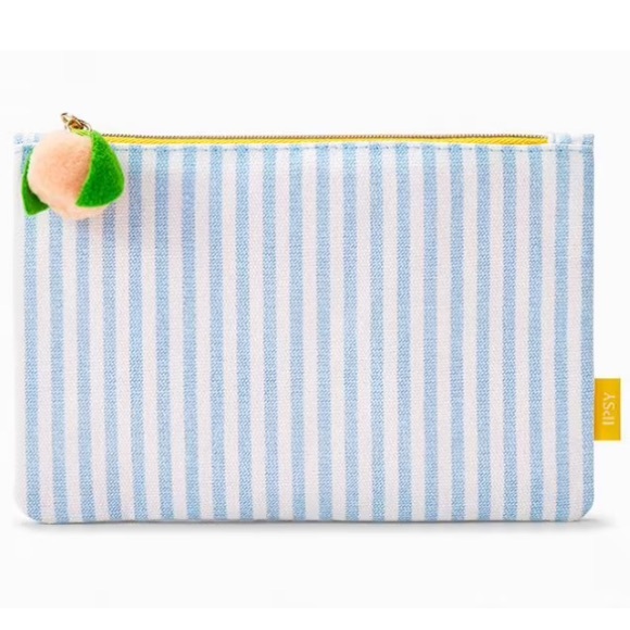 ipsy Handbags - Ipsy blue and white vertical stripe makeup bag with peach zipper pull